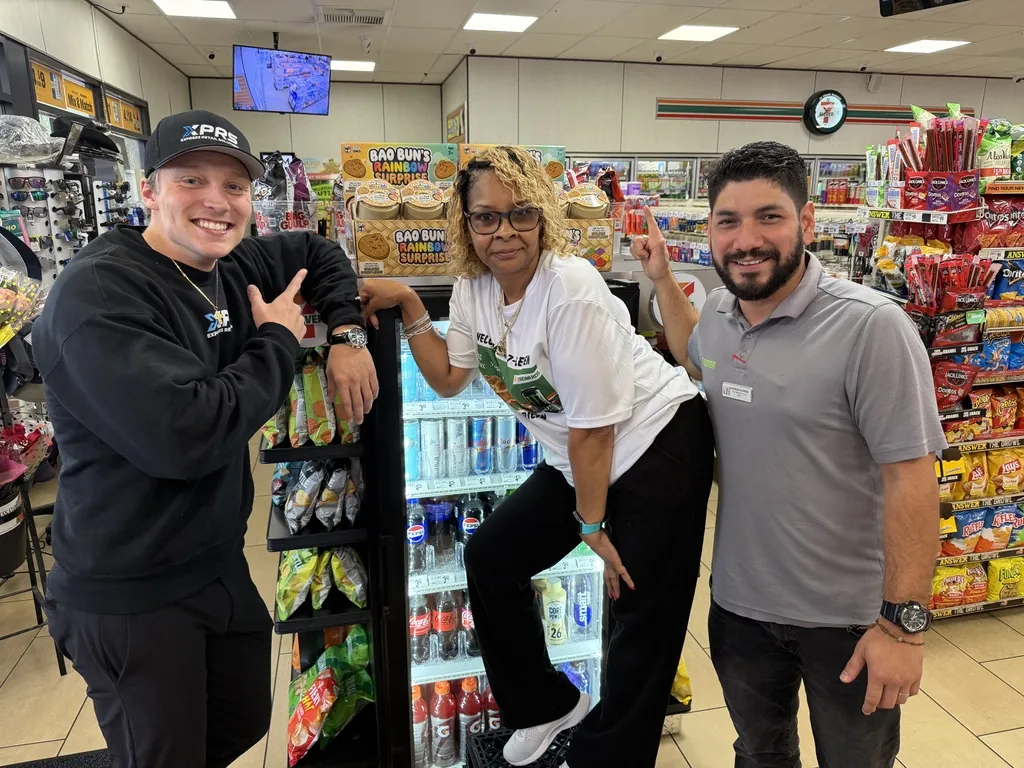 An XPRS rep with two store team members